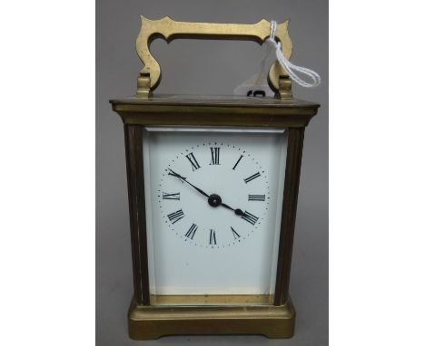 An early 20th century brass cased carriage clock, with white enamel dial and single train movement, 11cm high.