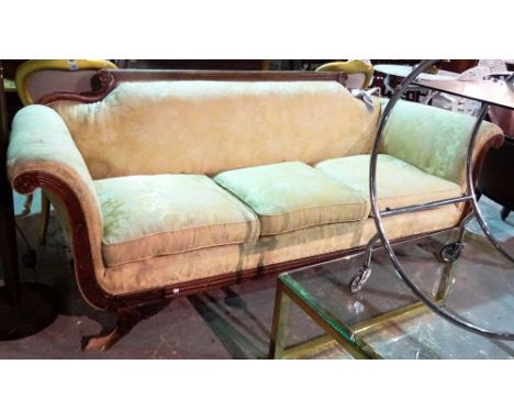 A Regency mahogany framed sofa, with fluted top rail and roll over arms, on claw feet, 210cm wide, (a.f).  J7