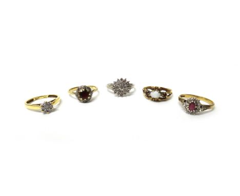 A gold, garnet and diamond set cluster ring, detailed 18 CT, a 9ct gold, ruby and diamond set oval cluster ring, two diamond 