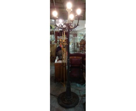 A 20th century green painted faux iron four light street lamp, 230cm high.  G6
