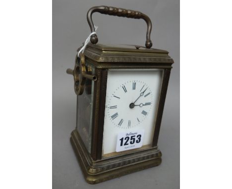 A brass gorge cased carriage clock, 19th century, with push repeat and a two train movement, 13cm high, with travel case and 