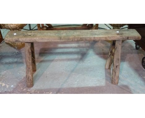 An elm rectangular bench on stake supports, 117cm wide x 52cm high, a similar stool, and a painted stool, 45cm wide x 47cm hi