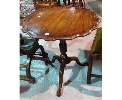 A George II mahogany tripod table, with pie-crust edging, on claw feet, 68cm wide x 72cm high.  B5