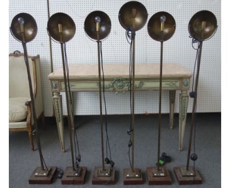 A matched set of six Art Deco style patinated metal standard lamps, modern, each with circular concave adjustable shade over 