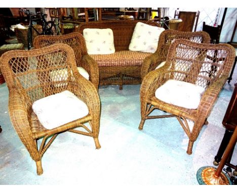 A 20th century rattan conservatory suite, comprising; a sofa (140cm wide), and four matching armchairs, (5).  F8