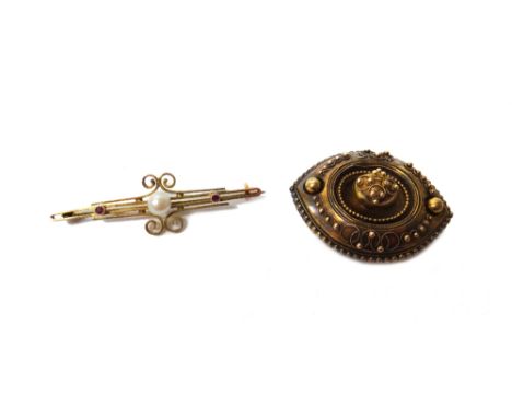 A Victorian oval brooch, with applied bead and wirework decoration, the back glazed with a locket compartment, circa 1870 and