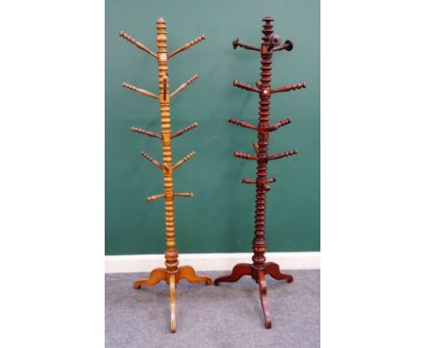 A 19th century bobbin turned fruitwood coat and hat stand, on tripod base, 187cm high, together with another similar, (2).