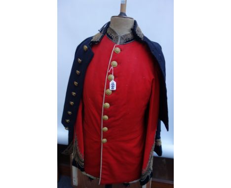 Two late 19th/early 20th century regimental coats, a red military coat and a black cutaway naval dress coat with gold braid d