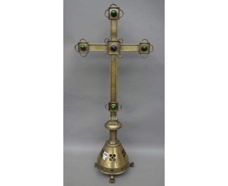 A Victorian brass altar crucifix, with applied coloured enamel cabochon over a pierced base, detailed 'In memory of the missi