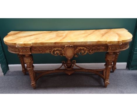 A console table in the mid-18th century French style, the faux marble top over a pierced and carved gilt base, on four taperi