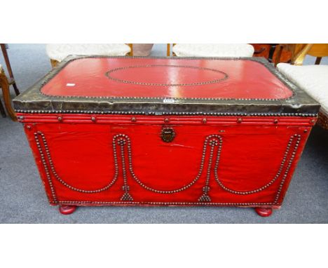 A 19th century brass veneered red painted rectangular pine trunk, on bun feet, 92cm wide x 52cm high x 53cm deep.