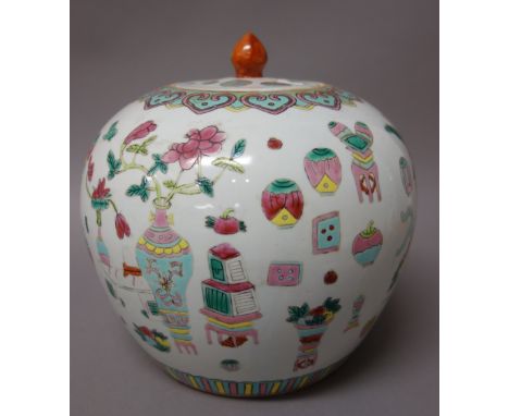 A Chinese famille-rose ginger jar and cover, circa 1900, painted with precious objects beneath a ruyi head border, 22cm. high