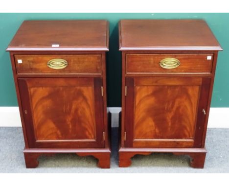 A pair of George III style mahogany bedside tables, each with single frieze drawer, over panelled cupboard, on bracket feet, 