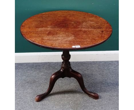 A mid-18th century mahogany occasional table, the circular snap top on a tripod base, 79cm diameter x 73cm high.