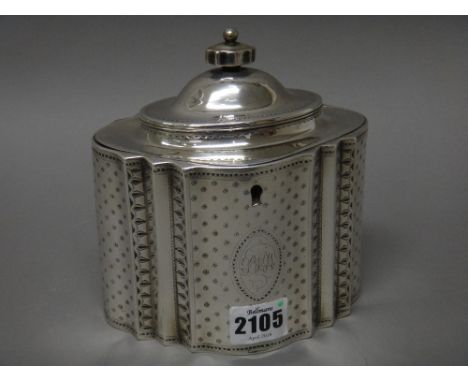 A George III silver hinge lidded tea caddy, of panelled oval form, having engraved decoration, the front with a monogram engr