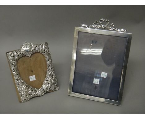 A silver mounted rectangular photograph frame, having a tied bow surmount, Chester probably 1901 and a Victorian silver mount