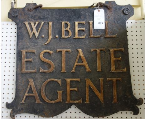 A wrought iron double sided hanging sign, 'W.J. Bell Estate Agent', circa 1920, with hanging bracket, 74cm wide x 65cm high F