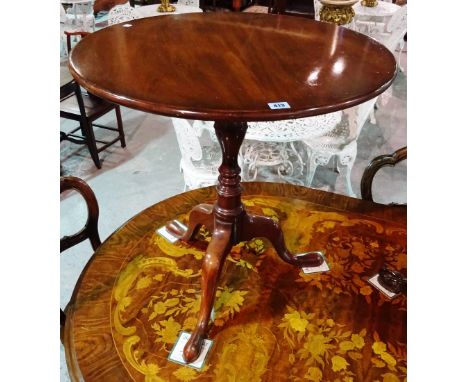 A George III style mahogany tripod table, on turned column and pad feet, 68cm wide x 71cm high, together with another similar