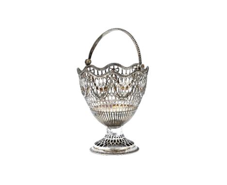 A George III silver sugar basket, with pierced decoration, above a fluted band, the top decorated with pendant swags, having 