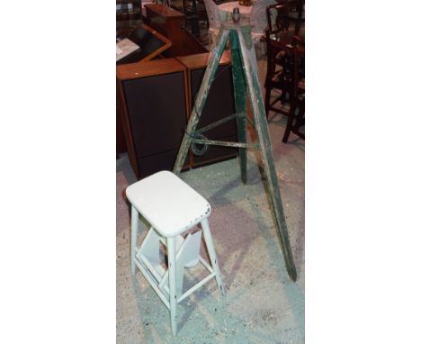 A 20th century green painted rustic tripod standard lamp and a grey painted metamorphic stool, (2). I1