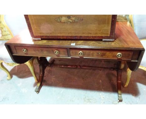 A Regency style mahogany sofa table, on dual lyre end supports, 108cm wide x 72cm high.   J7