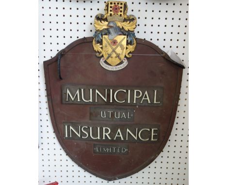 Municipal Mutual Insurance; a metal and enamel decorated hanging double sided sign, of shield form, with gilt heraldic crest 