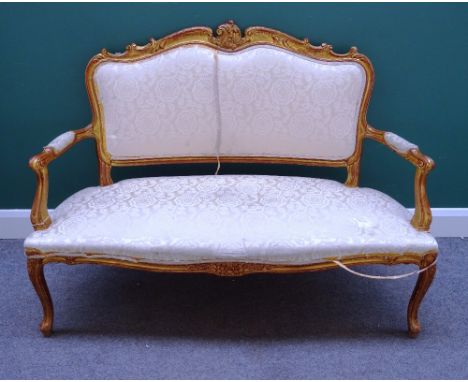 A Louis XV style gilt framed salon suite, to comprise; a sofa (135cm wide x 98cm high), a pair of open armchairs and four sin