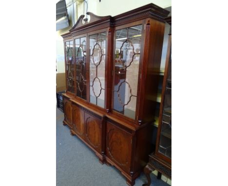 Charles Barr of Sandy; a George III breakfront mahogany bookcase cabinet, with four glazed doors over four panelled doors on 