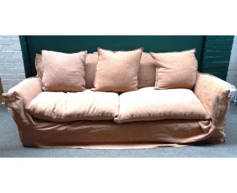 Conran; a 20th century three piece suite with loose tan covers, to include; a sofa (225cm wide x 85cm high) and pair of armch