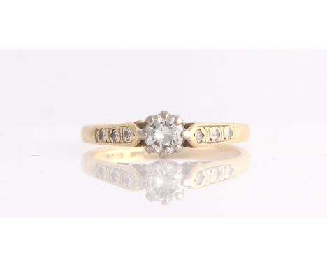 A hallmarked 18ct yellow gold diamond ring, set with a principal round brilliant cut diamond measuring approx. 0.40ct, each s