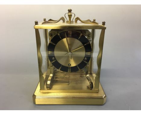 A brass and glass cased Schatz mantel clock. Height 21cm.