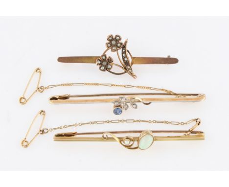 A sapphire and diamond bar brooch, stamped 15ct, an opal and seed pearl bar brooch, stamped 15ct, and a seed pearl bar brooch