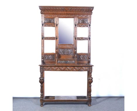 Victorian oak hall stand, gadrooned cornice above carved and mirrored panels, the base with turned legs, shelf and drip trays