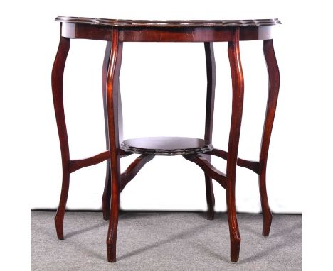 Victorian mahogany window table, serpentine top, cabriole legs joined by a small shelf, 73x73cm, height 73cm.