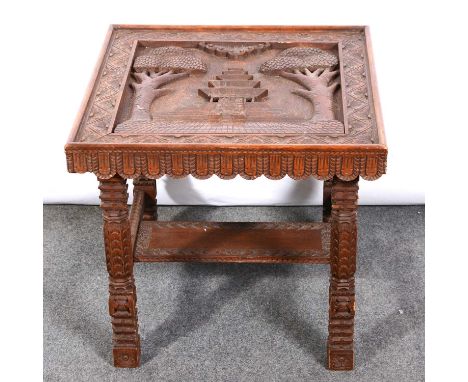 Asian carved softwood table, the top decorates with a temple, legs joined by a shelf, 50x50cm, height 47cm, and a carved hard