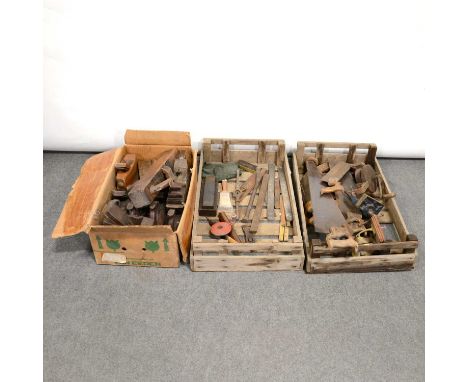 Three boxes of tools, to include a panel plane by Buck, jack planes, saws; clamps; brass bell; American sharpener.Qty: 3 boxe