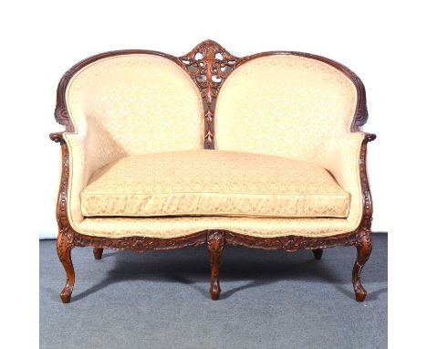 French walnut small sofa, carved and pierced frame, scrolled arms and cabriole legs, width 121cm, depth 90cm, height 91cm.Con