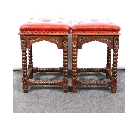 A pair of oak bobbin turned stools, carved frieze and bobbin turned stretchers, one small panel carved with the name "Barbara