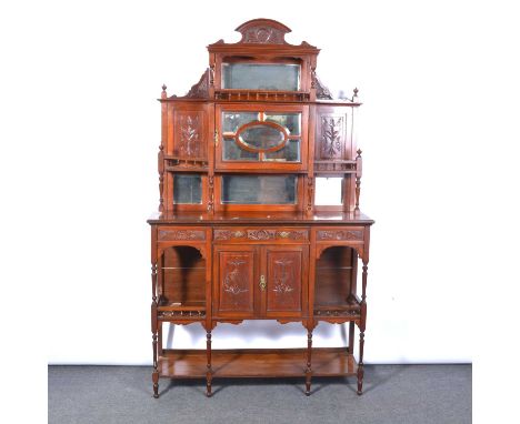 Victorian walnut chiffonier, arched pediment, the upper section with mirrored panels and a cupboard, the base with a drawer a
