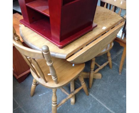 A LIGHT WOOD TABLE AND TWO CHAIRS