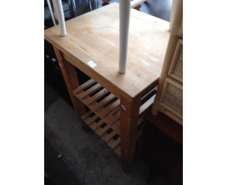 A LIGHT WOOD KITCHEN STAND