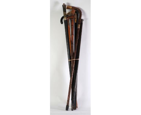 EARLY 20th CENTURY WALKING STICK with pinchbeck mounted horn handle engraved with inscription dated 1915, EIGHT OTHERS includ