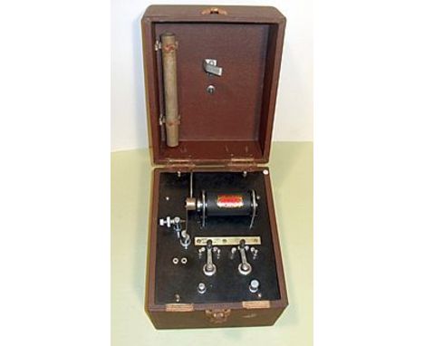 INDUCED CURRENT COIL, , with electro-magnetic interrupter and draw tube with a turned wood knob, all in a polished wooden cas