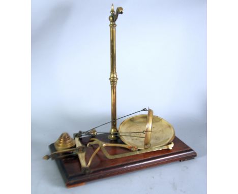 W & T AVERY LTD. PAIR OF EARLY TWENTIETH CENTURY BRASS COUNTER TOP BEAM SCALES, of traditional design on oblong mahogany base