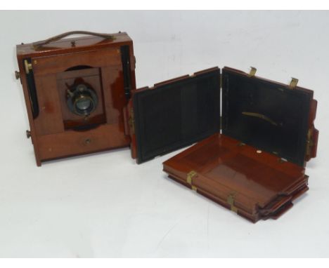 J. LANCASTER BRASS MOUNTED MAHOGANY CASED PLATE CAMERA and THREE MAHOGANY PLATE CARRIERS (4)