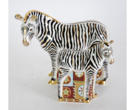 ROYAL CROWN DERBY CHINA PAPERWEIGHT IN THE FORM OF A STANDING ZEBRA with gilt button/stopper, 7" (17.8cm) wide x 5" (12.7cm) 