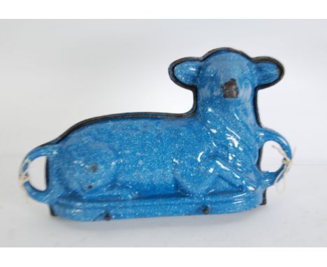 AN UNUSUAL EARLY 20th CENTURY FRENCH CAST IRON CAKE MOULD IN THE FORM OF A TWO PART RECUMBENT LAMB, the exterior finished in 