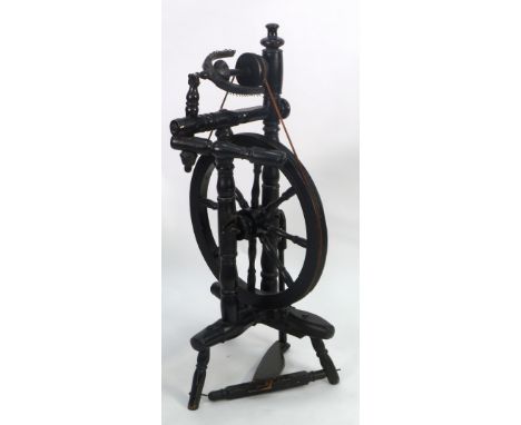 ANTIQUE EBONISED PEDAL DRIVEN UPRIGHT SPINNING WHEEL, on tripod base, 37" (94cm) high 