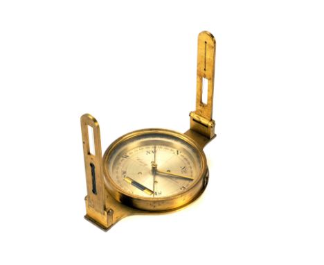 A Cary of London Mining Dial, lacquered brass with two folding sights and spirit level, tripod mount to base, in maker’s maho