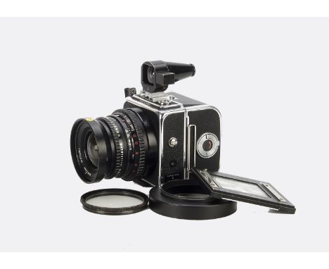 A Hasselblad Super Wide C Camera, chrome, serial no. UUW15050, with Carl Zeiss Biogon T* f/3.5 38mm lens, black, serial no. 5